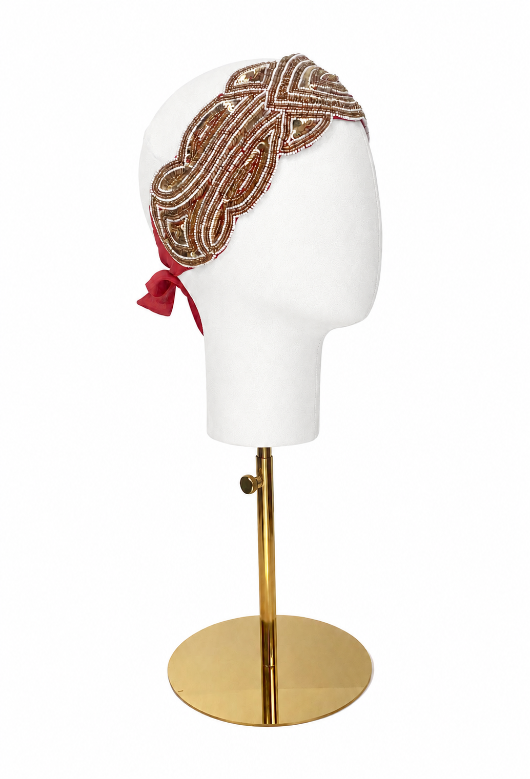 Silk bandeau headband with gold embroidery and red ribbon on a mannequin