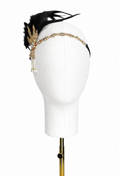 Black feather headband with gold jeweled chain and dangling bead detail
