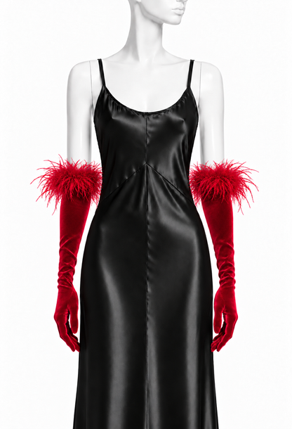 Red velvet opera gloves with fluffy feather cuffs worn at the wrist