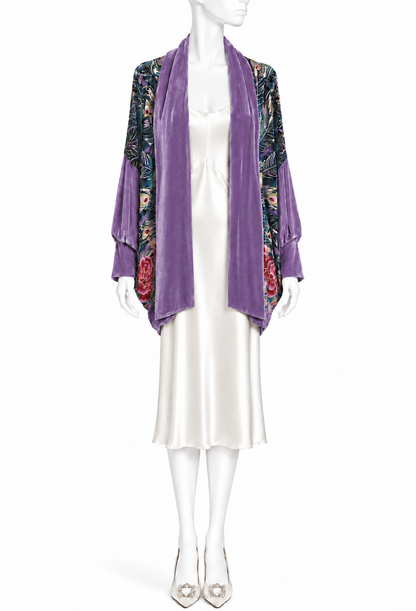 Purple velvet cocoon wrap with open front, draped collar, peacock-patterned trim