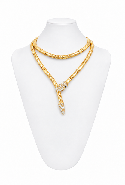 Gold serpent mesh necklace with snake-head clasp and dangling tail detail