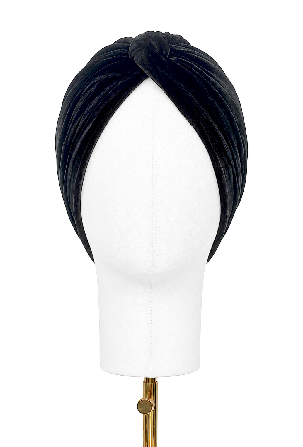 Black velvet draped turban headband on mannequin, twisted front knot