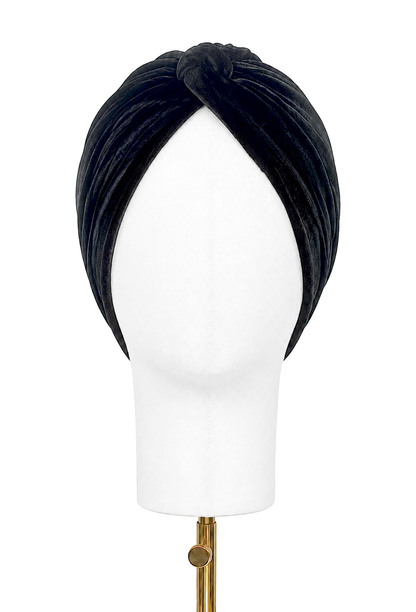 Black velvet draped turban headband on mannequin, twisted front knot