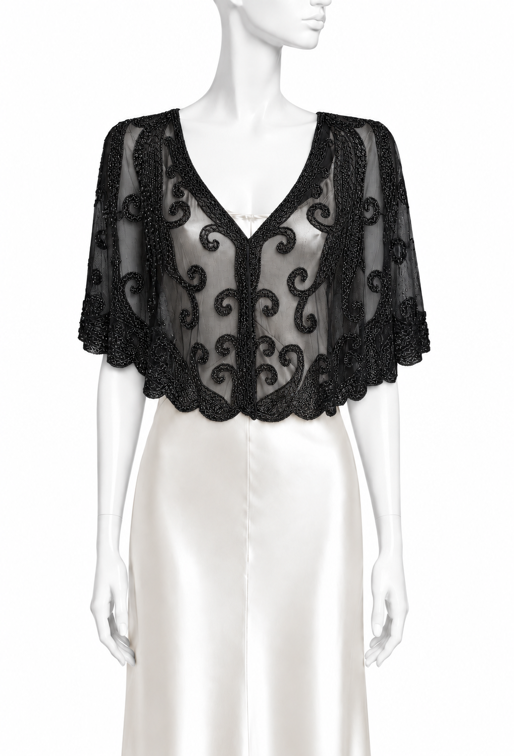 Black lace capelet with scalloped V neckline and swirling embroidered trim