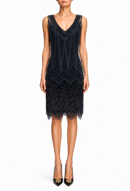 Noir sleeveless V-neck dress with textured pattern and fringed hem