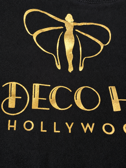 Black studio tee with gold foil angel graphic and Deco Haus lettering