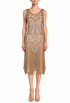Gold beaded sleeveless gown with art deco pattern and fringe hem